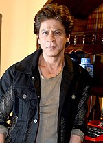Picture of Shah Rukh Khan looking at the camera.