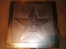 A metal star engraved with Link's name and The Legend of Zelda game title