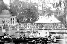 Garrick's Lawn in Hampton filled with spectators watching the Molesey Regatta on 1 August 1921.