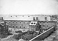 View of the scaffold and hanging bodies of the Lincoln Assassination conspirators taken from roof of the arsenal