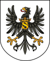 Herb Prus Książęcych z literą „S” od imienia króla: Sigismundus (Zygmunt)