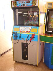 An arcade cabinet with two gun controllers