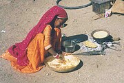A girl from the Gadia Lohars nomadic tribe of Marwar, cooking her food.