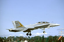 Photo of a modern fighter aircraft flying with its landing gear extended