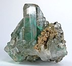 Colorless cerussite crystal that has been included by wisps of light green malachite