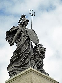A photograph of a statue of Britannia on a stone plinth outdoors