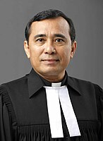 An Ephorus of the Batak Christian Protestant Church in Indonesia, one of the largest Lutheran churches in Southeast Asia, wearing uses white bands and Geneva gown