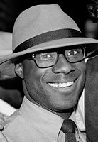 A black and white photograph of Barry Jenkins attending his 30th birthday party