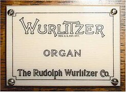 The Rudolph Wurlitzer Company logo on a pipe organ
