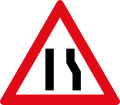 Roadway narrows from the right side ahead