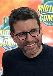 The film’s co-writer Rhett Reese smiling at a 2018 event