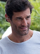 Portrait of Mark Webber smiling and looking to the left of the camera
