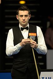 Mark Selby holding a cue stick