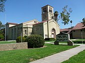 A school building with clock tower. An announcement board "South Pasadena Middle School" is visible.