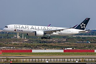 Thai Airways Airbus A350-900 in Star Alliance livery with black tail, the most common design variant.