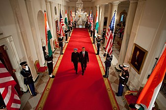 President Barack Obama and Prime Minister Manmohan Singh of India on a red carpet at the White House.
