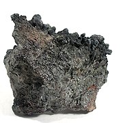 Rheniite crystals on a base of hardened lava, from Kudriavy Volcano