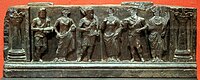 Greco-Buddhist frieze of Gandhara with devotees, holding plantain leaves, in Hellenistic style, inside Corinthian columns, 1st–2nd century CE. Buner, Swat, Pakistan. Victoria and Albert Museum.