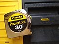 A Stanley tape measure and tool box