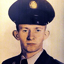 A portrait photo of a white man in a Cold-War US military uniform; he is facing the camera, looking into the lens