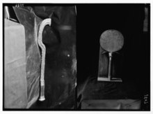 Two side-by-side monochromatic images of an ancient metallic scepter and a mirror