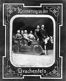 Dyson, fourth from the left, rides in an automobile; possibly during the Fifth Conference of the International Union for Co-operation in Solar Research, held in Bonn, Germany, 1913