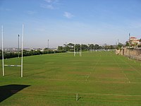 De rugby fields wey dey separate de Upper Campus den Middle Campus