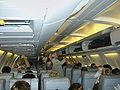 Having boarded, passengers stow their cabin baggage - Lufthansa Boeing 737-500.
