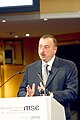 Ilham Aliyev speaking at a podium
