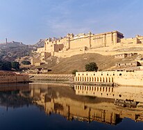 Amber Fort as seen from the bank of Maotha Lake, Jaigarh Fort on the hills in the background