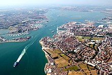 An aerial view of western side of Portsmouth (including Gunwharf Quays, the dockyard and the Spinnaker tower), the harbour itself, and the town of Gosport