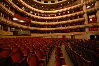 Seats in opera houses and theaters are traditionally red. This is the Opera House in Vienna.