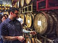 Image 16A beer sommelier tapping a barrel for a taste at Nebraska Brewing Company (from Craft beer)