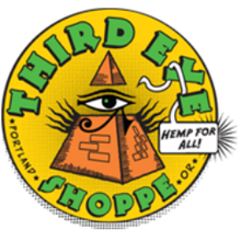 Yellow circular logo with "Third Eye Shoppe", "Portland", "OR" , and "Hemp for All!" displayed at the edges; in the center is the Eye of Providence within a pyramid