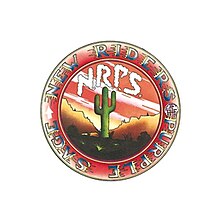 A desert scene with a saguaro cactus, and clouds spelling "N.R.P.S."