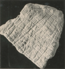 A chalk artefact with criss-cross grooves