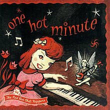 A stylized red-tinted image of a girl playing a piano while a fairy sits on it playing guitar