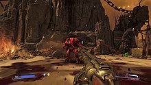 Screenshot from Doom showing the player fighting a Baron of Hell with the Super Shotgun