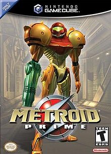 Samus Aran, the main character in Metroid Prime, is in a in a big, futuristic-looking powered suit with a helmet. There is a firearm on the right arm and large, bulky, and rounded shoulders, stands on an industrial-like corridor. Atop the image is the Nintendo GameCube logo, and the text "Only for" in the upper left corner. In the bottom of the image, the title "Metroid Prime" in front of an insignia with a stylized "S", the Official Nintendo Seal of Quality, Nintendo's logo, and ESRB's rating of "T".