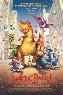 In the middle of a city street lie several floating balloons, a background audience, and multiple characters upfront. There are four prehistoric reptiles, including (from left to right) a green Parasaurolophus, an orange Tyrannosaurus Rex, a purple Pterodactyl, and a blue Triceratops. There is also a green alien in the middle-to-top-left, a boy and a girl together in the middle-to-bottom-left, and a man between the Tyrannosaurus' legs.