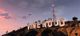 The summit of an in-game mountain with eight billboards that display letters to spell out the word "Vinewood"