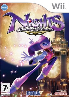 The cover art shows NiGHTS, the game's main protagonist, floating in the air with a Big Ben-like tower in the foreground, and a large full moon behind it.