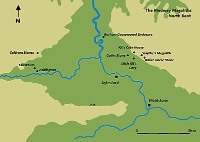 A map featuring a river moving from the top of the image (north) to the bottom right corner (southeast). Various black dots mark out the location of Medway Megaliths on either side of the river.