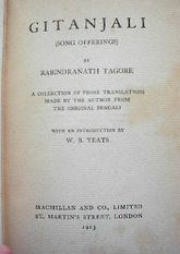 Close-up of yellowed title page in an old book: "Gitanjali (Song Offerings) by Rabindranath Tagore. A collection of prose translations made by the author from the original Bengali with an introduction by W. B. Yeats. Macmillan and Co., Limited, St. Martin's Street, London, 1913."